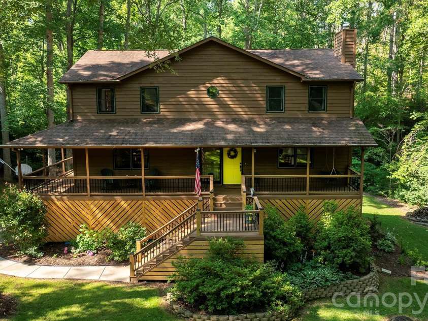 17 Morris Drive, Weaverville, NC 28787.  MLS# CAR4333064, YatesRealty ID 30498. Freshly Painted and Rebuilt Wrap-Around Deck with new Lattice boards to add beauty to the Entire Exterior Bottom of the Home.