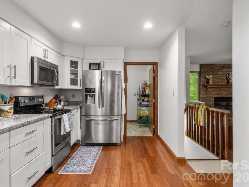 17 Morris Drive, Weaverville, NC 28787.  MLS# CAR4333064, YatesRealty ID 30498. The laundry room and walk-in pantry are located of the kitchen for you convenience. 