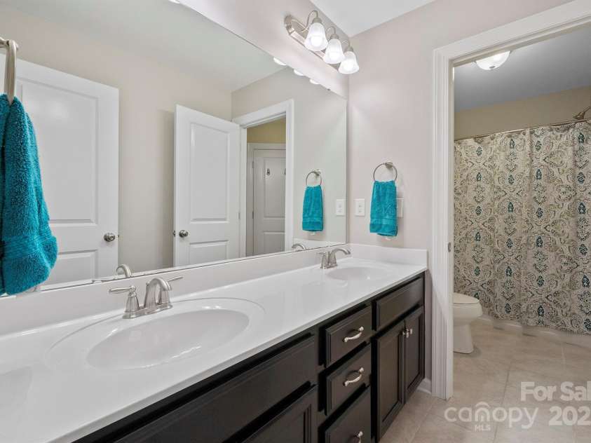 7322 Dulnian Way, Charlotte, NC 28278.  MLS# CAR4272540, YatesRealty ID 30530. Bathroom 2 with dual sinks