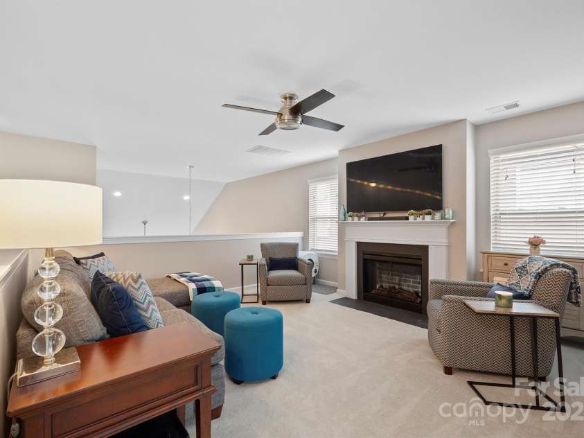 7322 Dulnian Way, Charlotte, NC 28278.  MLS# CAR4272540, YatesRealty ID 30530. Generous sized loft with fireplace overlooking great room.
