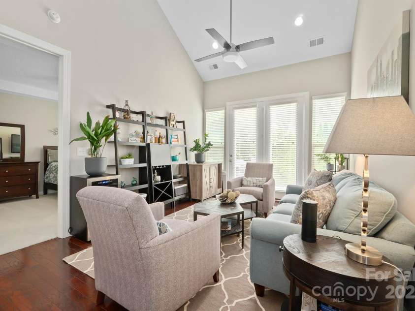 7322 Dulnian Way, Charlotte, NC 28278.  MLS# CAR4272540, YatesRealty ID 30530. Great room with vaulted ceiling and cooling fan.