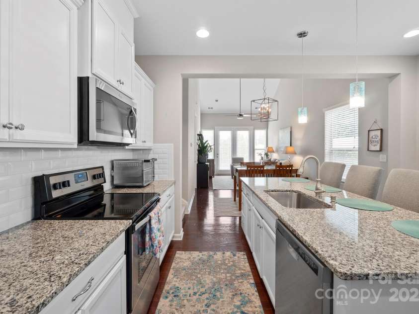 7322 Dulnian Way, Charlotte, NC 28278.  MLS# CAR4272540, YatesRealty ID 30530. Kitchen opens to 2 story great room. Gas hookup behind stove for those who prefer gas.