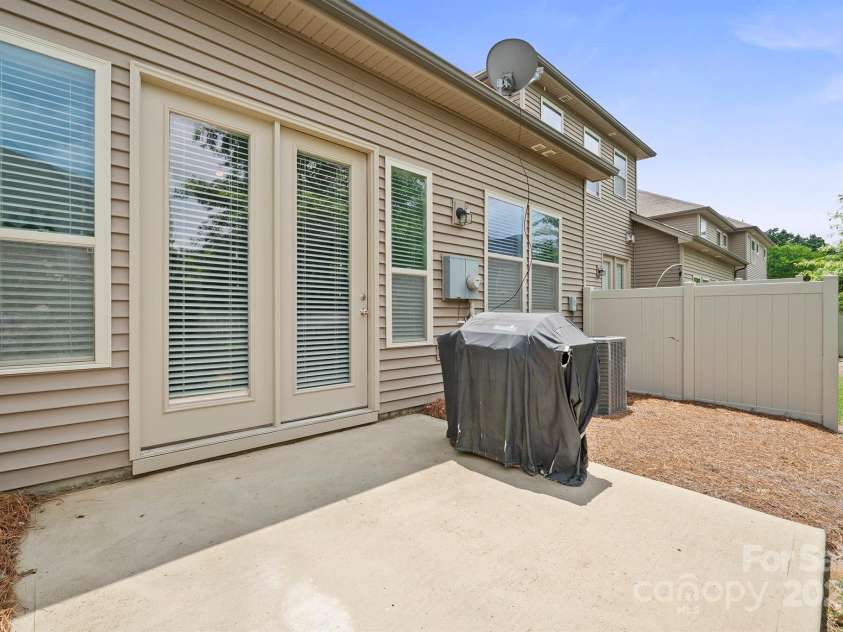 7322 Dulnian Way, Charlotte, NC 28278.  MLS# CAR4272540, YatesRealty ID 30530. Patio area in back, perfect for grilling and relaxing.