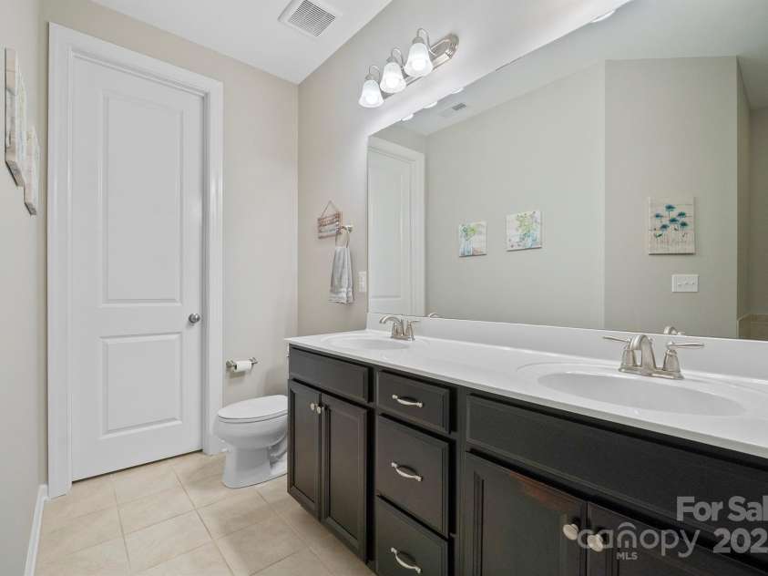 7322 Dulnian Way, Charlotte, NC 28278.  MLS# CAR4272540, YatesRealty ID 30530. Primary bathroom vanity with dual sinks.