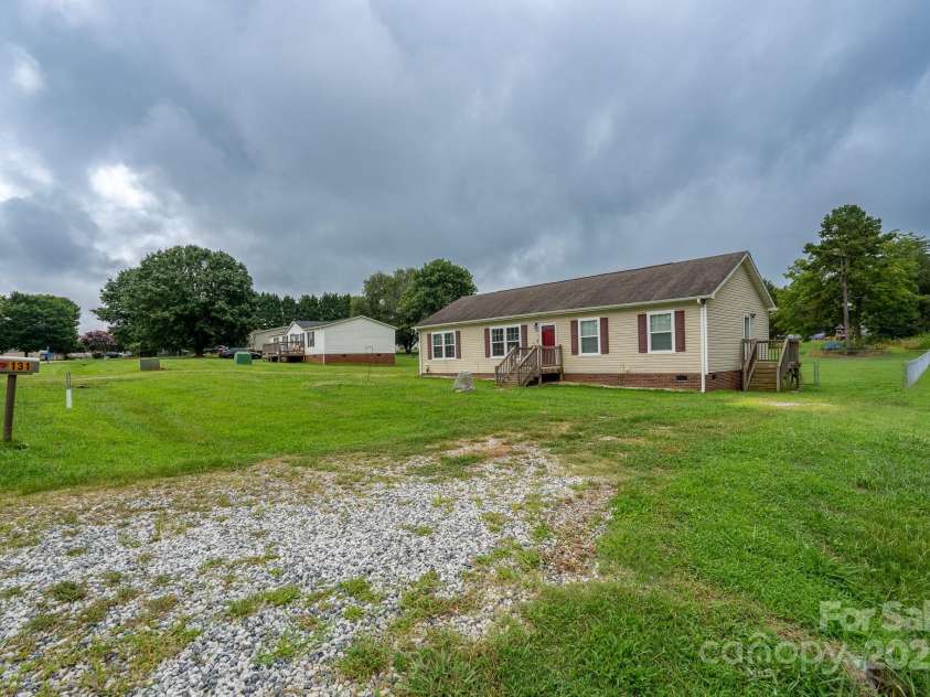 131 Brown Farms Drive, Cleveland, NC 27013.  MLS# CAR4278638, YatesRealty ID 30536. Gravel drive
