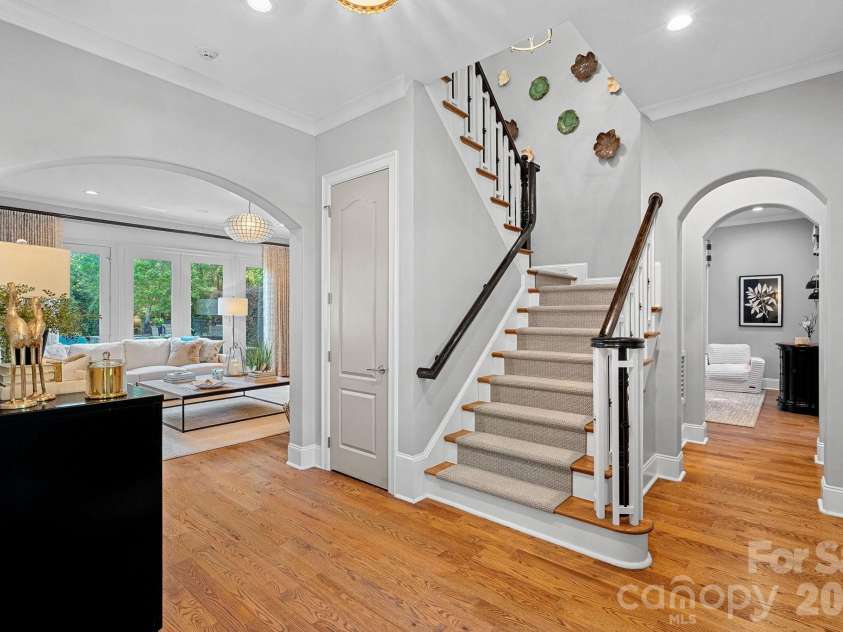104 Maddaket Loop, Mooresville, NC 28117.  MLS# CAR4373825, YatesRealty ID 30540. Pretty Staircase to the Upper Level with Coat Closet Below