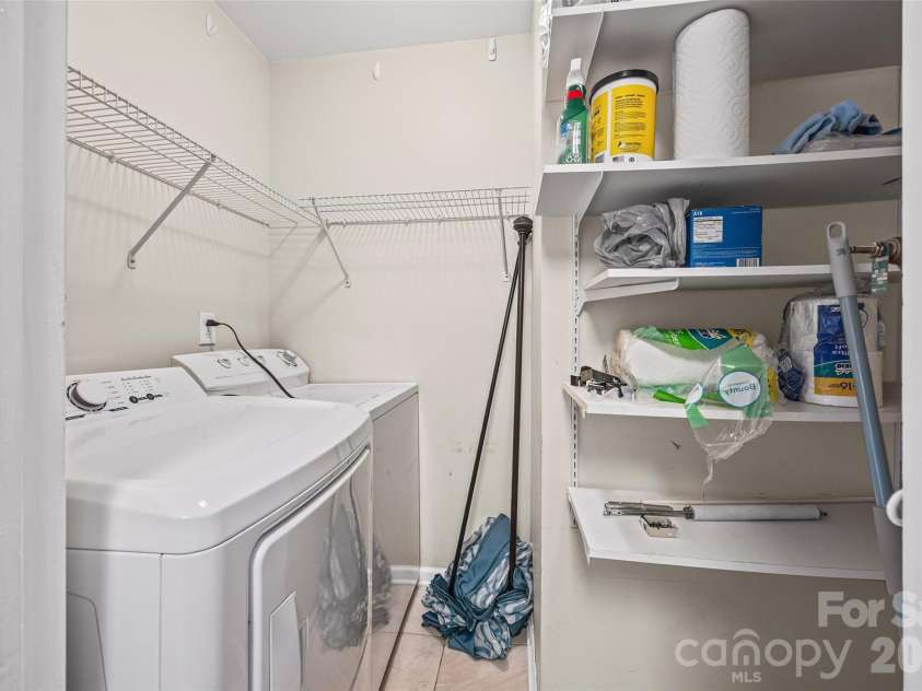 8117 Circle Tree Lane, Charlotte, NC 28277.  MLS# CAR4383359, YatesRealty ID 30542. Laundry with washer and dryer plus storage
