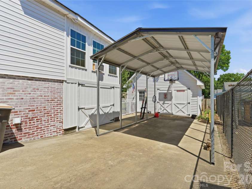 502 Ridge Avenue, Kannapolis, NC 28083.  MLS# CAR4390165, YatesRealty ID 30543. Driveway w/ Carport