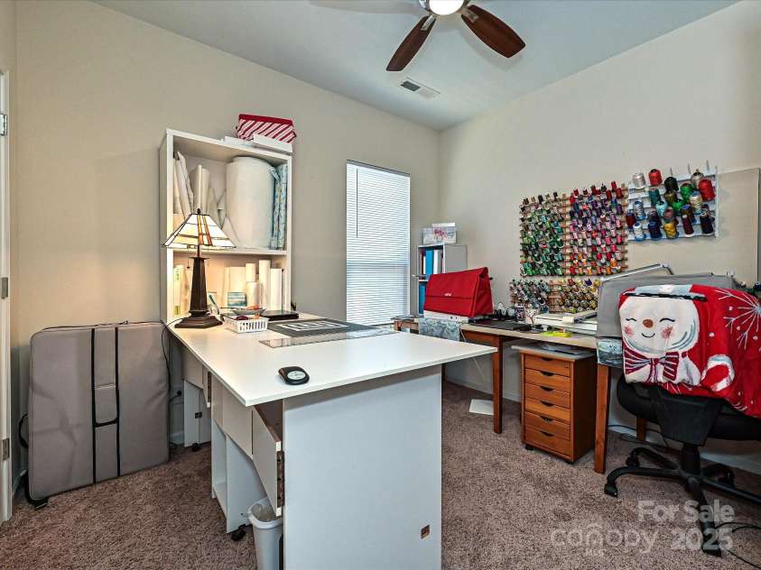 8024 Carolina Lakes Way, Fort Mill, SC 29707.  MLS# CAR4215671, YatesRealty ID 30555. Guest room currently being used as a craft room