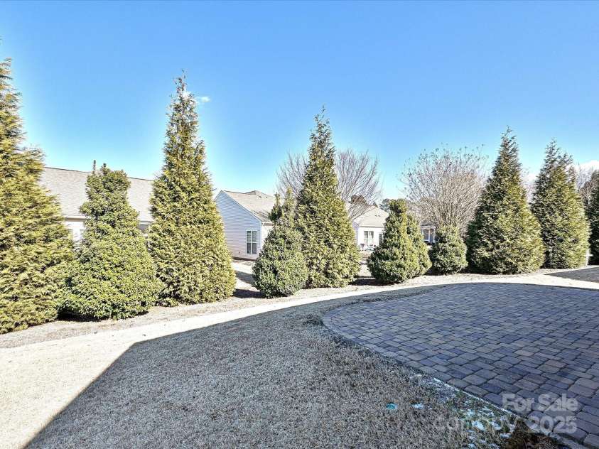 8024 Carolina Lakes Way, Fort Mill, SC 29707.  MLS# CAR4215671, YatesRealty ID 30555. Trees in backyard