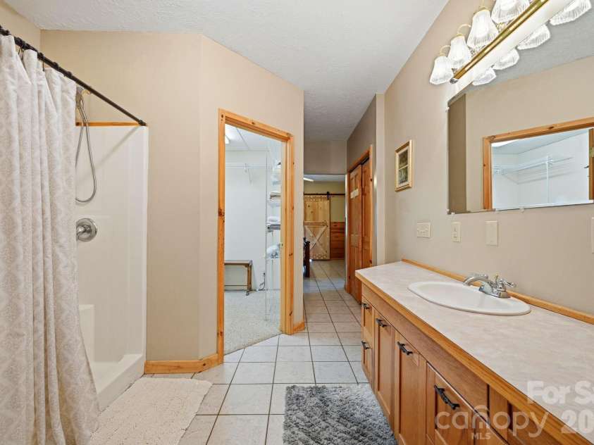 605 Valley View Drive, Purlear, NC 28665.  MLS# CAR4393524, YatesRealty ID 30559. Primary Ensuite Bathroom