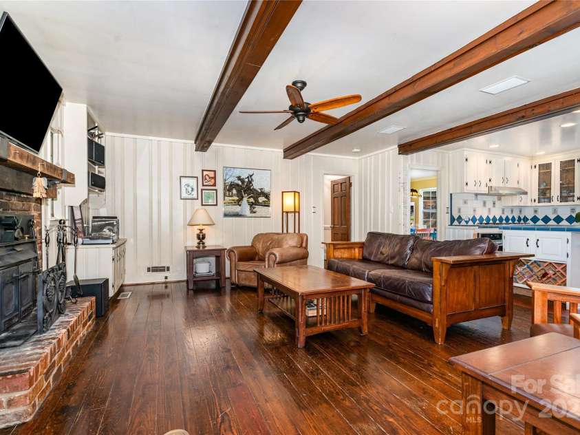 5811 Doncaster Drive, Charlotte, NC 28211.  MLS# CAR4281754, YatesRealty ID 30581. Den w/ wood burning Fireplace
