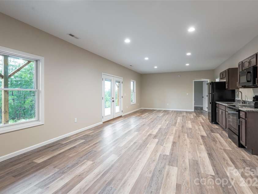 181 Flint Morgan Road, Mars Hill, NC 28754.  MLS# CAR4288459, YatesRealty ID 30594. Large Family Room in Basement