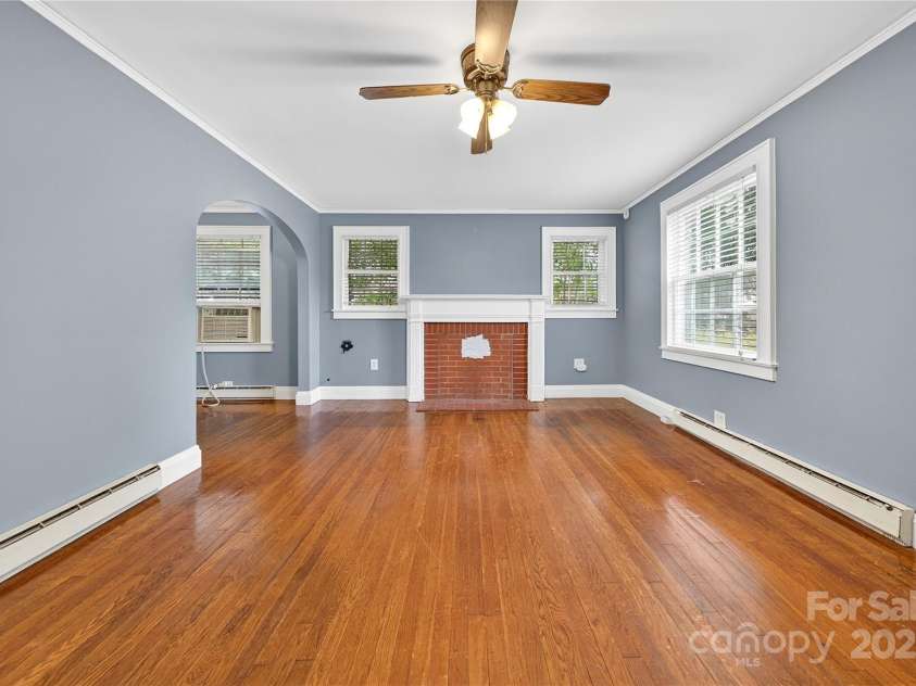 662 Carpenter Avenue, Mooresville, NC 28115.  MLS# CAR4286895, YatesRealty ID 30605. Living Room has traditional mantlepiece, likely where an old wood stove once stood