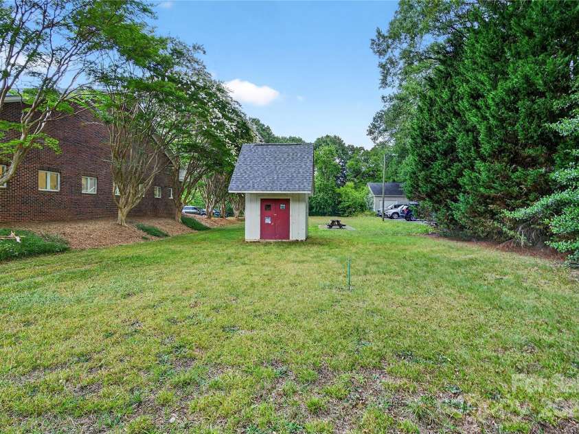 662 Carpenter Avenue, Mooresville, NC 28115.  MLS# CAR4286895, YatesRealty ID 30605. Storage outbuilding has double doors and attic storage!