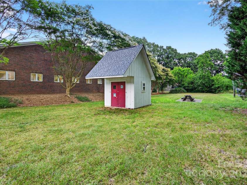 662 Carpenter Avenue, Mooresville, NC 28115.  MLS# CAR4286895, YatesRealty ID 30605. Storage Shed and Picnic Area of the backyard