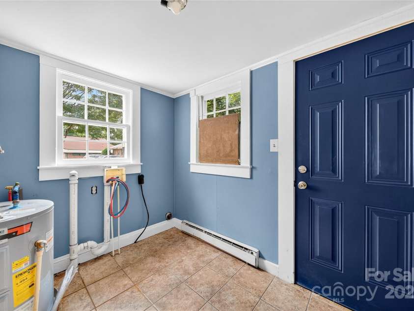662 Carpenter Avenue, Mooresville, NC 28115.  MLS# CAR4286895, YatesRealty ID 30605. Utility Room has new door to back yard