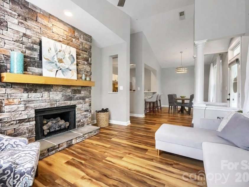 706 Northeast Drive, Davidson, NC 28036.  MLS# CAR4385734, YatesRealty ID 30606. Livingroom with stone fireplace