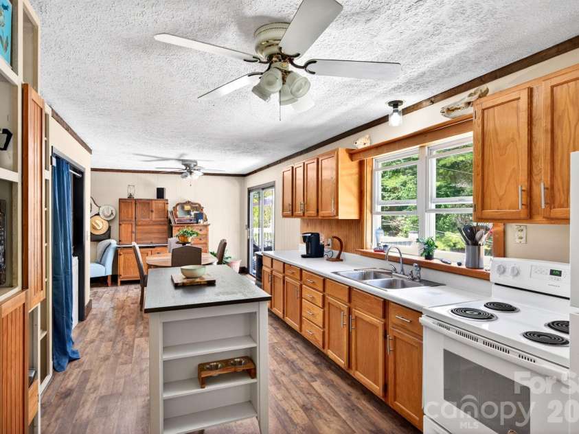 30 Reeves Drive, Burnsville, NC 28714.  MLS# CAR4391470, YatesRealty ID 30607. Kitchen Looking To Dining Area
