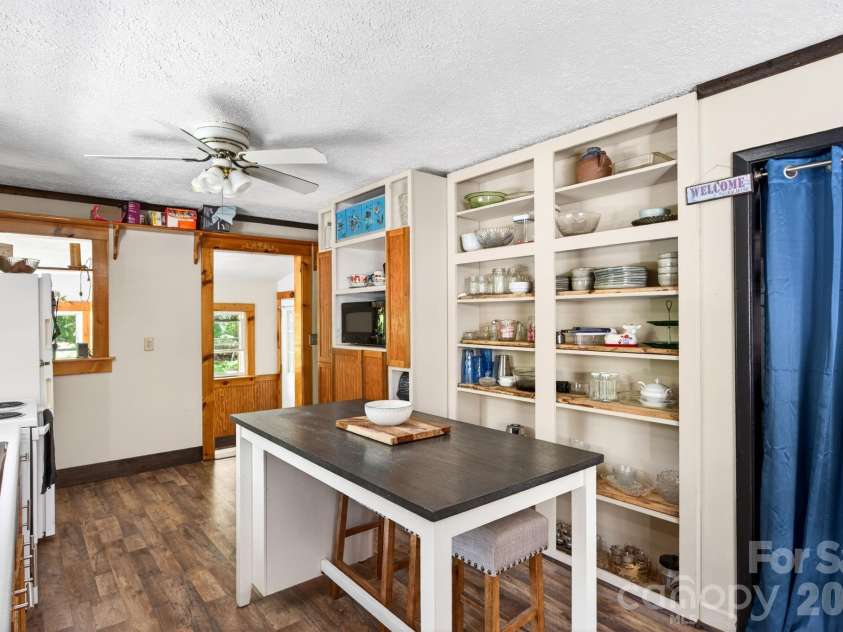 30 Reeves Drive, Burnsville, NC 28714.  MLS# CAR4391470, YatesRealty ID 30607. Kitchen Storage