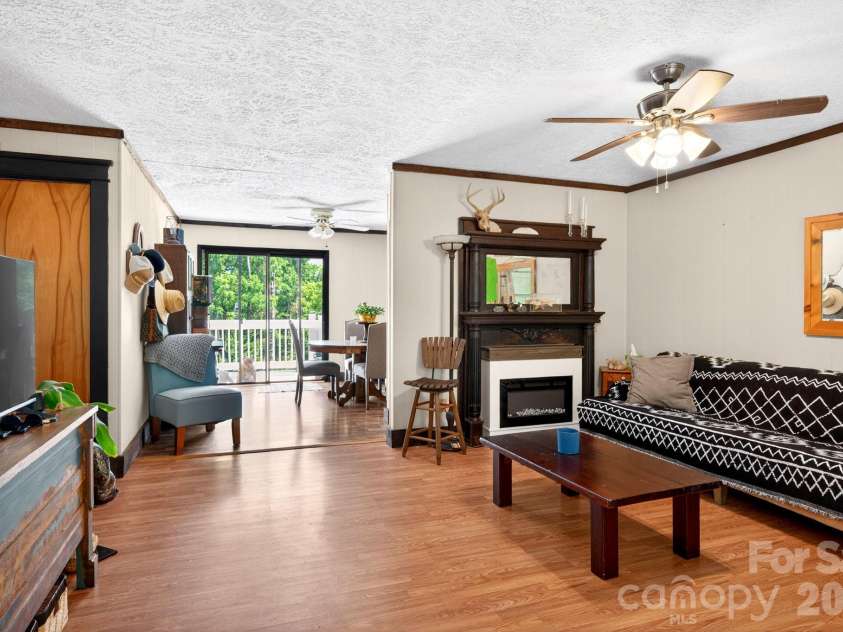 30 Reeves Drive, Burnsville, NC 28714.  MLS# CAR4391470, YatesRealty ID 30607. Living Room Looking OUt Back