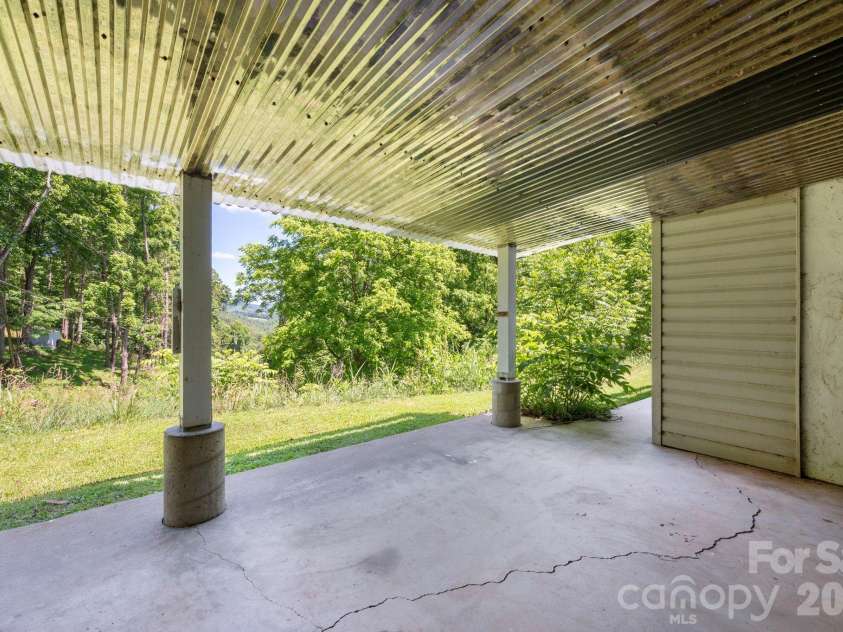 30 Reeves Drive, Burnsville, NC 28714.  MLS# CAR4391470, YatesRealty ID 30607. Lower Covered Patio