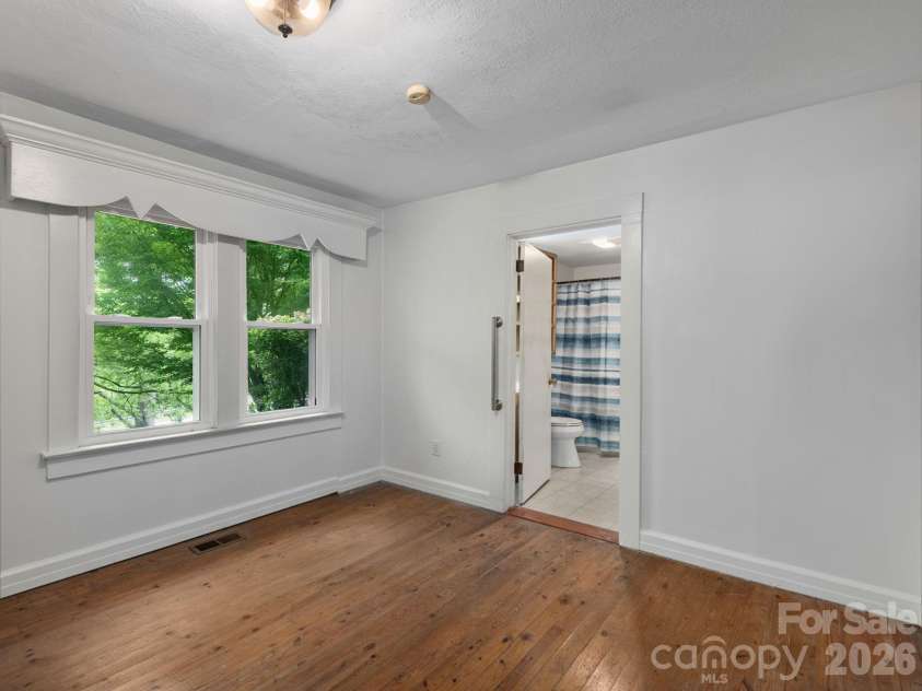 24 Piney Ridge Mountain Road, Zirconia, NC 28790.  MLS# CAR4382170, YatesRealty ID 30608. Spacious Ensuite Bedroom
