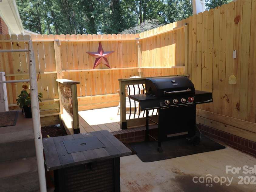 100 Ruby Lane, Gastonia, NC 28054.  MLS# CAR4284435, YatesRealty ID 30609. Private Deck at end of carport