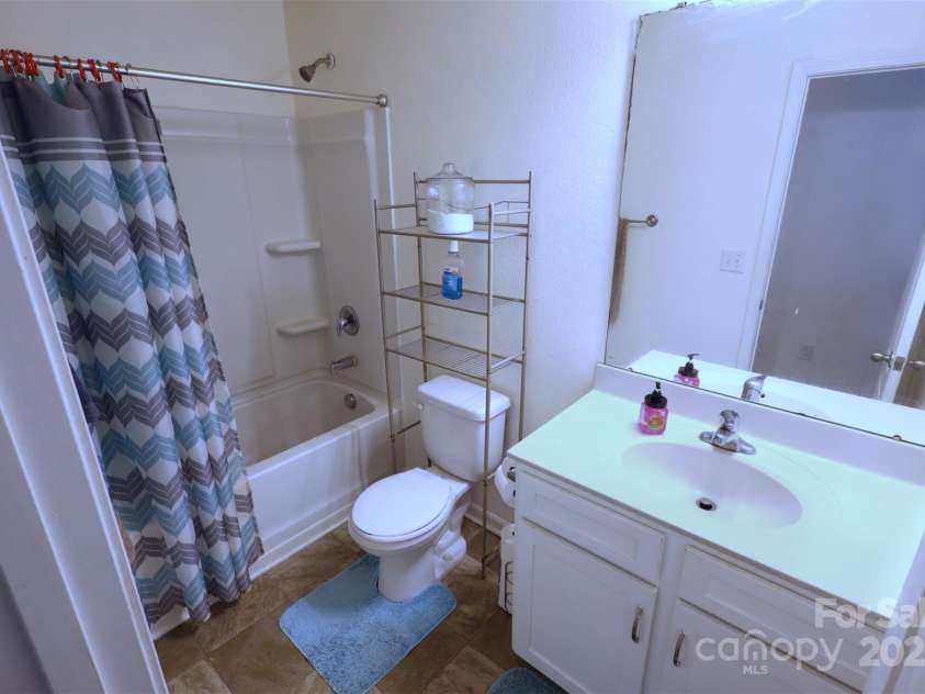 6919 Ware Road, Charlotte, NC 28212.  MLS# CAR4263043, YatesRealty ID 30611. Hall Bathroom