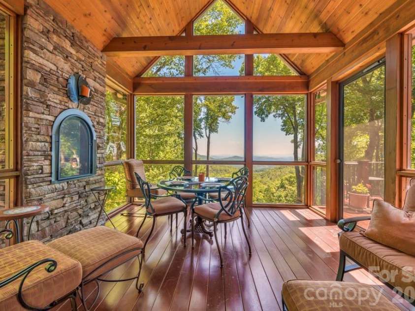 847 Old Orchard Road, Blowing Rock, NC 28605.  MLS# CAR4384622, YatesRealty ID 30618. Enclosed sunroom with fireplace and views!