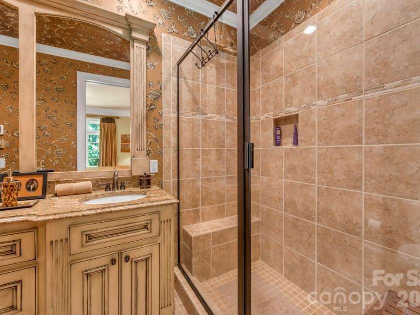 847 Old Orchard Road, Blowing Rock, NC 28605.  MLS# CAR4384622, YatesRealty ID 30618. Main-level bedroom suite bath with double vanity