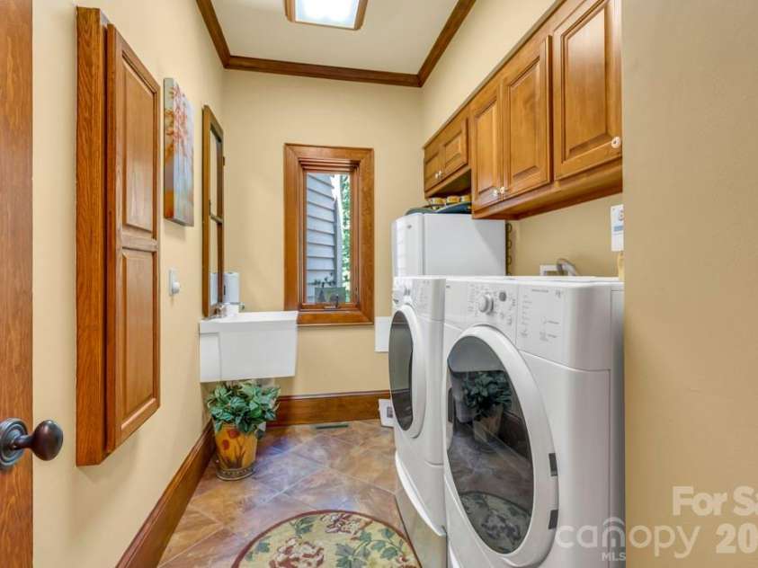 847 Old Orchard Road, Blowing Rock, NC 28605.  MLS# CAR4384622, YatesRealty ID 30618. Main-level laundry room with sink & storage