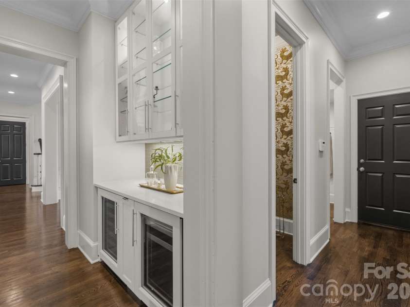 18407 Peninsula Cove Lane, Cornelius, NC 28031.  MLS# CAR4391272, YatesRealty ID 30620. Convenient to hosting, bar location features dual beverage refrigerators plus lighted cabinetry and pull out wine storage.
