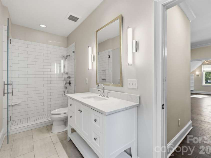 18407 Peninsula Cove Lane, Cornelius, NC 28031.  MLS# CAR4391272, YatesRealty ID 30620. En suite bath complete with step in shower and full tile.