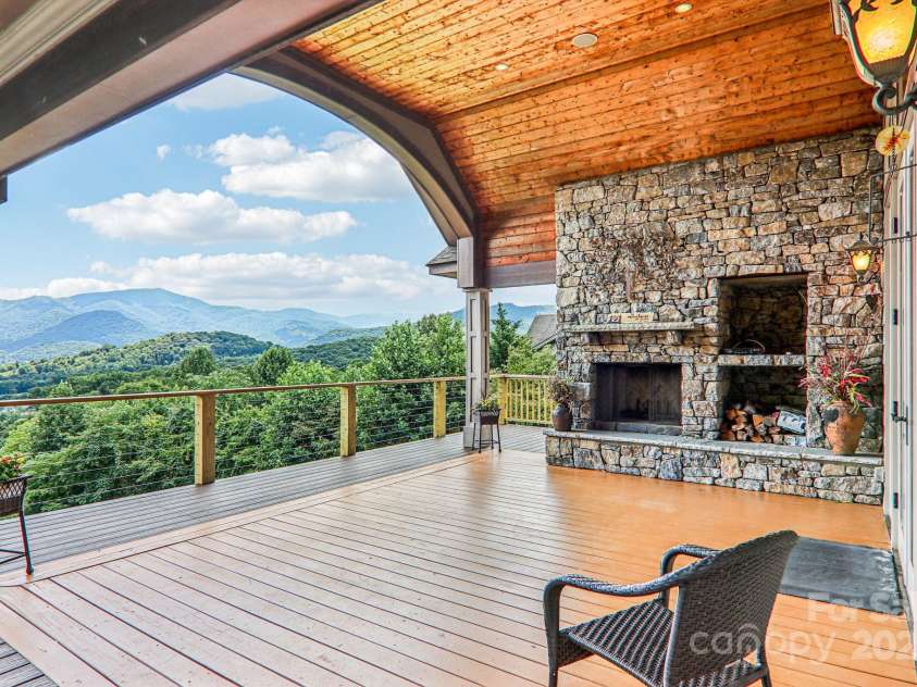 149 Cardinal Lane, Waynesville, NC 28786.  MLS# CAR4284459, YatesRealty ID 30625. Upper deck with fireplace