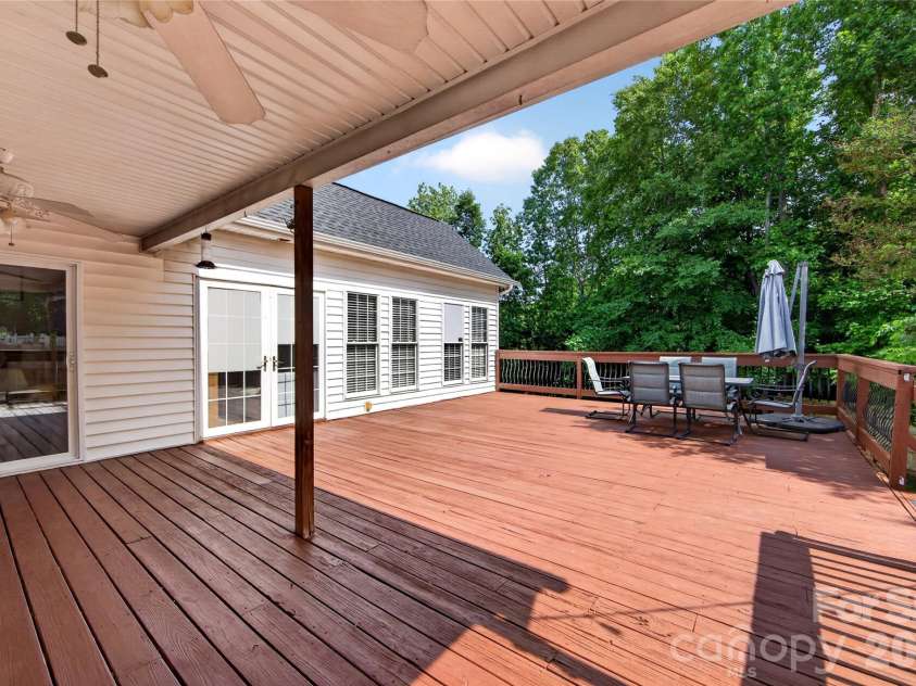 8628 Brookgreen Drive, Mint Hill, NC 28227.  MLS# CAR4380326, YatesRealty ID 30627. Covered deck area