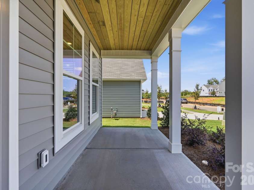 151 Grouse Run Way, Troutman, NC 28166.  MLS# CAR4382567, YatesRealty ID 30632. Front porch