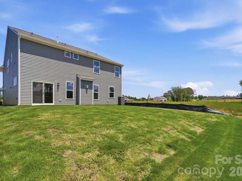 151 Grouse Run Way, Troutman, NC 28166.  MLS# CAR4382567, YatesRealty ID 30632. Rear of home