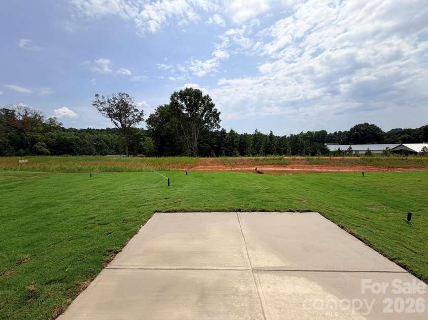 153 Grouse Run Way, Troutman, NC 28166.  MLS# CAR4383145, YatesRealty ID 30634. Backyard with Patio