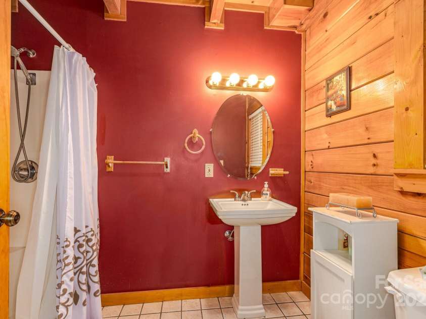 8331 Sugar Hill Road, Marion, NC 28752.  MLS# CAR4288059, YatesRealty ID 30642. Bathroom off primary bedroom