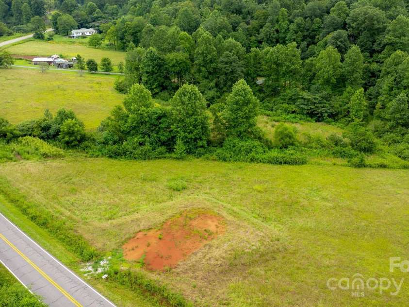 8331 Sugar Hill Road, Marion, NC 28752.  MLS# CAR4288059, YatesRealty ID 30642. Road view of pasture