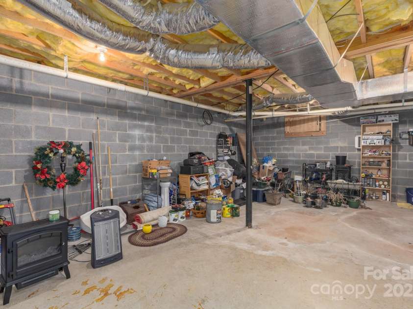8331 Sugar Hill Road, Marion, NC 28752.  MLS# CAR4288059, YatesRealty ID 30642. Storage room basement