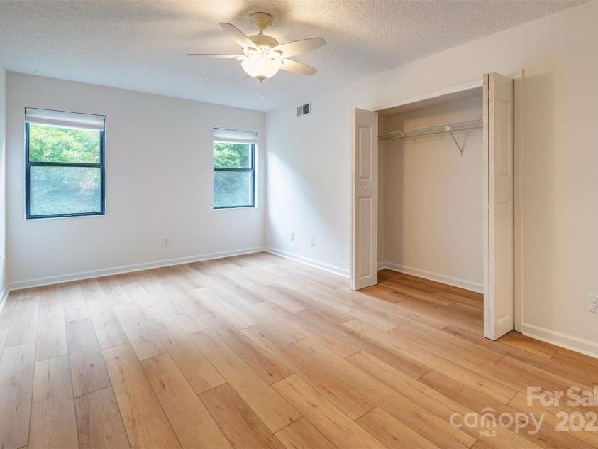 1103 Abbey Circle, Asheville, NC 28805.  MLS# CAR4285880, YatesRealty ID 30643. Primary bedroom with two large closets