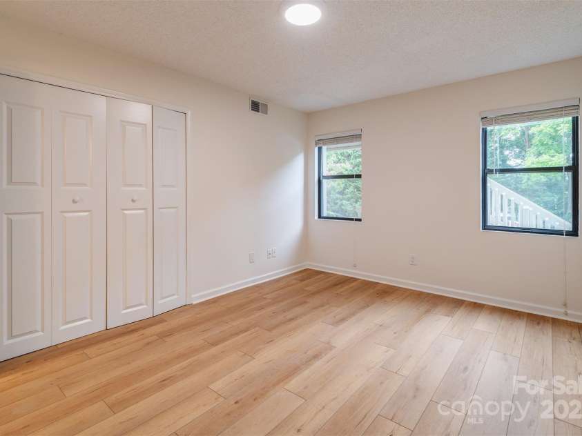 1103 Abbey Circle, Asheville, NC 28805.  MLS# CAR4285880, YatesRealty ID 30643. Second bedroom with large closet