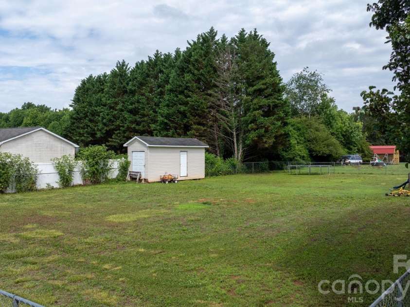 150 Bost Nursery Road, Maiden, NC 28650.  MLS# CAR4388448, YatesRealty ID 30643. Backyard with Shed