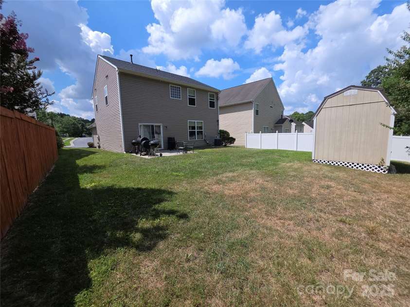 3042 Ernest Russell Court, Charlotte, NC 28269.  MLS# CAR4286579, YatesRealty ID 30655. Large backyard