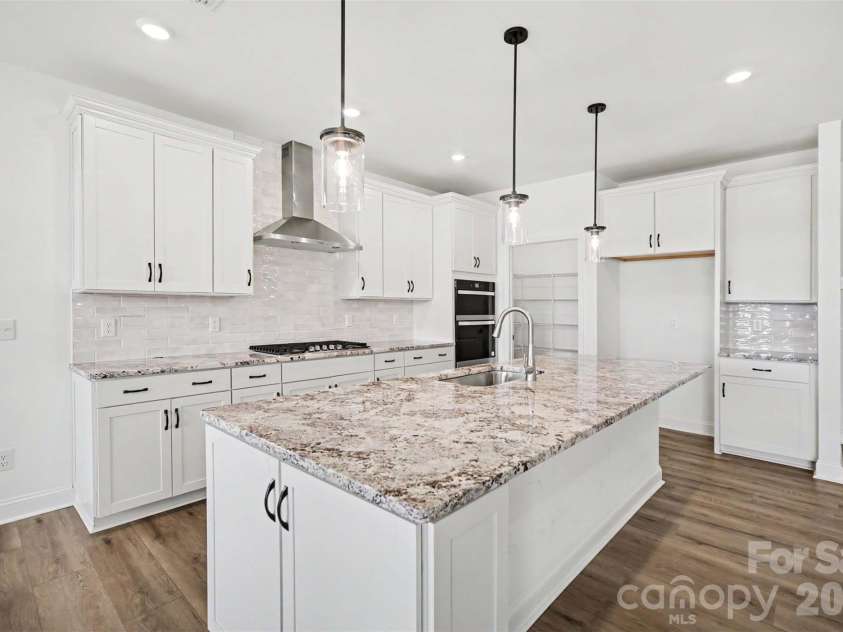 1949 Sparkling Stream Drive, Belmont, NC 28012.  MLS# CAR4383579, YatesRealty ID 30666. Upgraded gourmet kitchen.