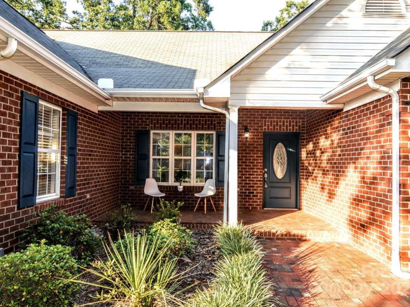 4304 Mara Lane, Monroe, NC 28110.  MLS# CAR4283425, YatesRealty ID 30670. Bring the rocking chairs and enjoy the shade.