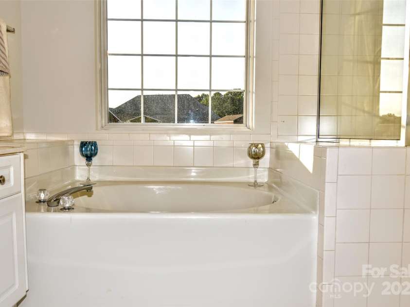 4304 Mara Lane, Monroe, NC 28110.  MLS# CAR4283425, YatesRealty ID 30670. Garden tub and separate shower complete the master bath suite.
