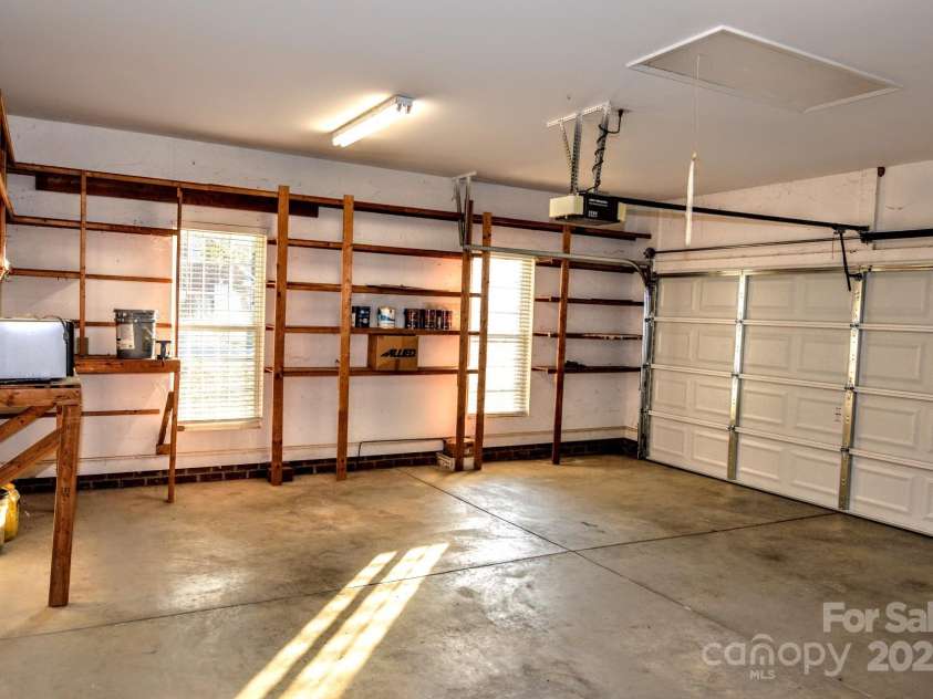 4304 Mara Lane, Monroe, NC 28110.  MLS# CAR4283425, YatesRealty ID 30670. This garage is huge-- 556 square feet with new garage doo and remotes as well as a separate access door.